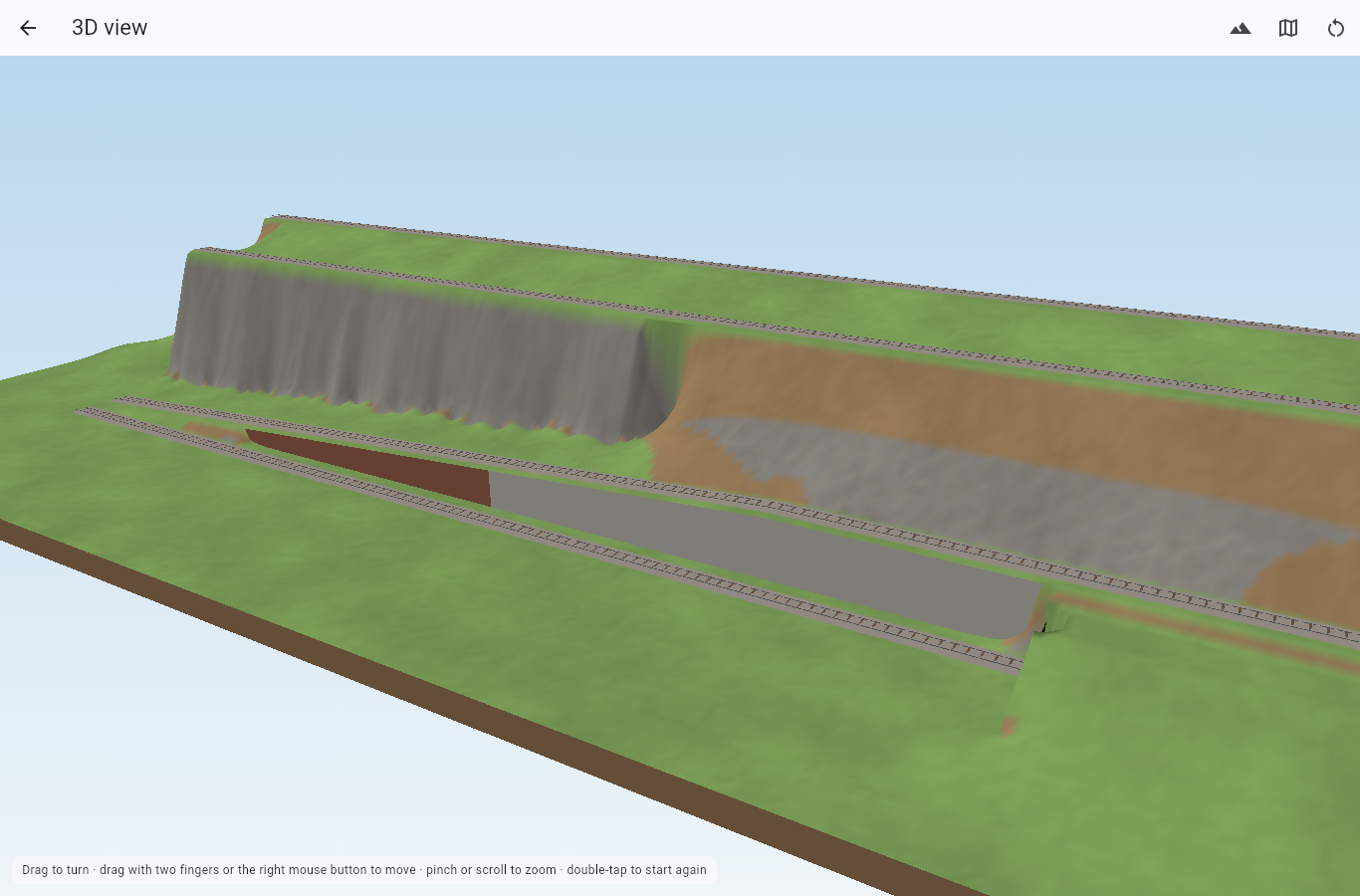 The 3D view of a layout with a wall, a rock face and a tunnel